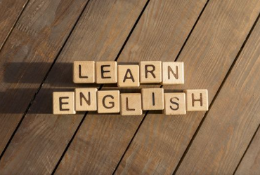 A student team communication practicing spoken English structures